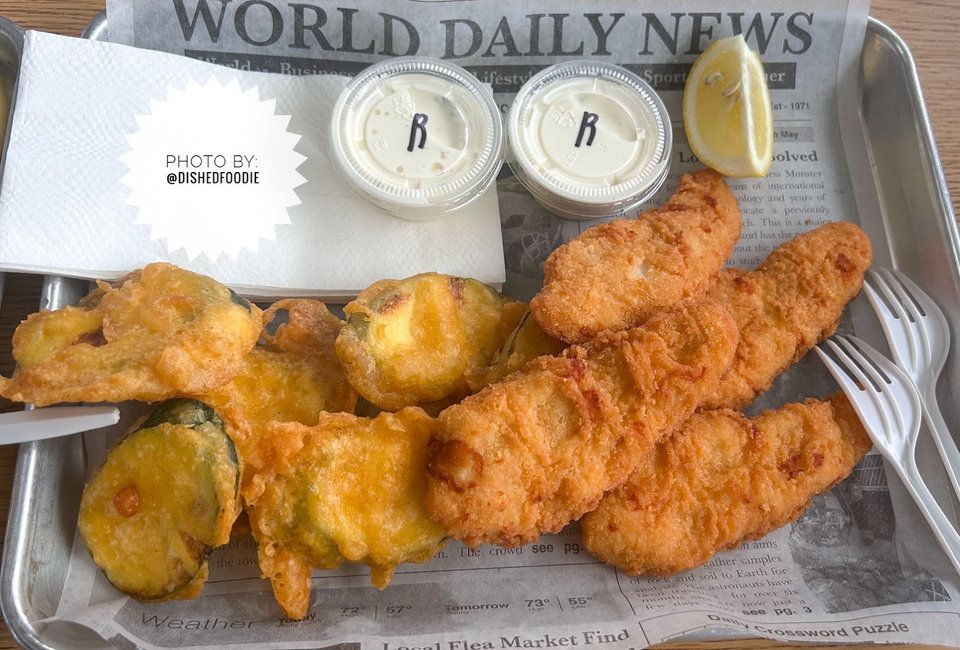 Golden seafood basket with fries and tartar sauce.