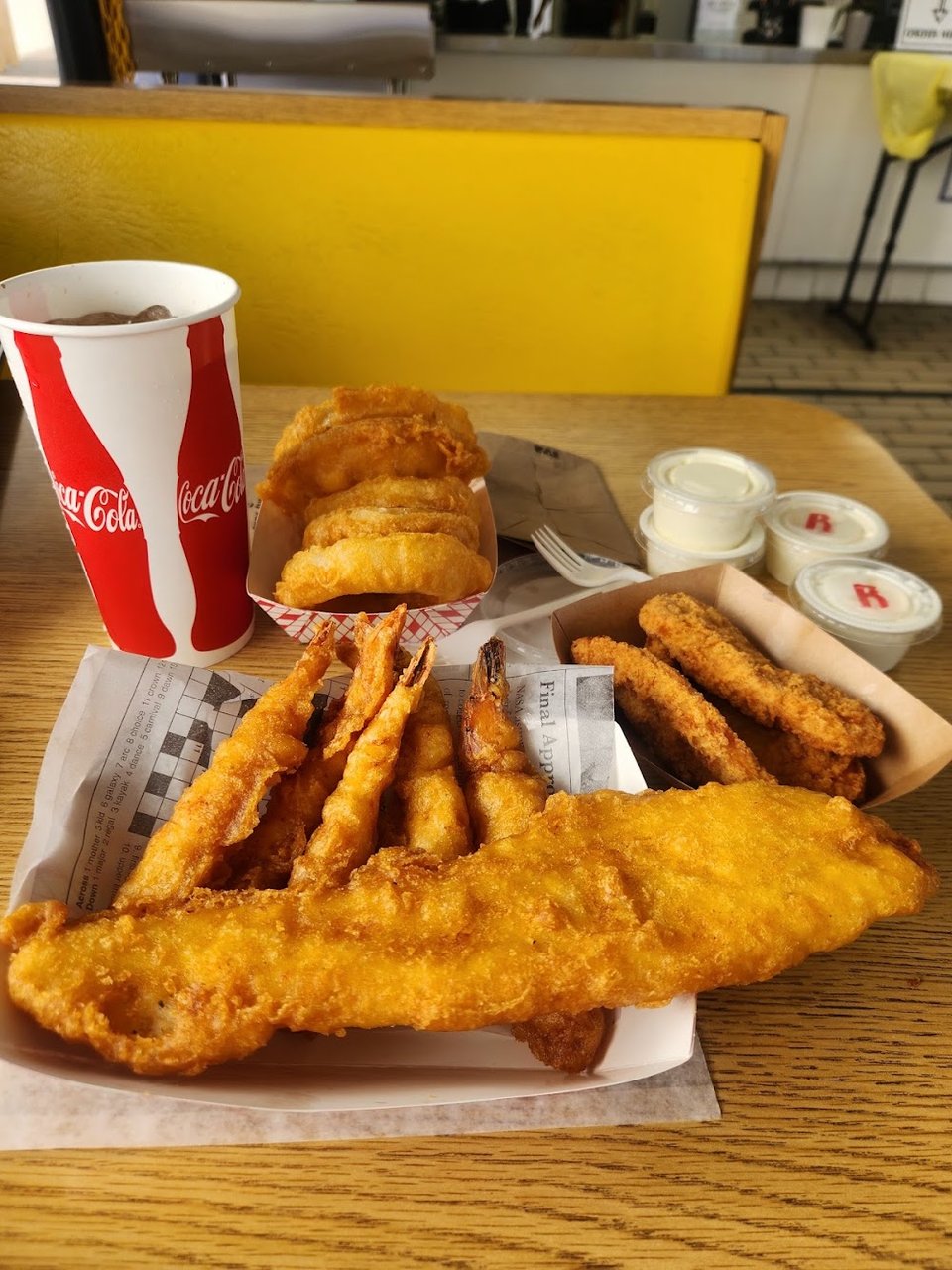 Fried seafood selections listed on a simple counter menu.